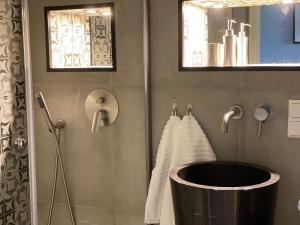 a bathroom with a bath tub and a sink at Schwarzwald Wohnung Kniebis in Freudenstadt +22 photos