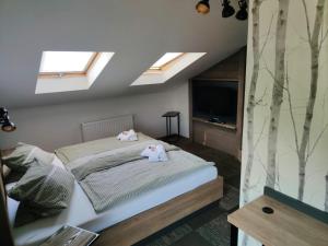 Ein Bett oder Betten in einem Zimmer der Unterkunft Pension Gemshorn