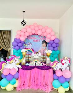 a pink and purple balloon arch with a little pony party at Casa LiLa Homestay Private Pool Taman Kota Seribong Kota Bharu in Kampong Kubang Kachang +32 photos