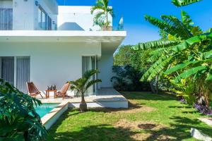 a view of the backyard of a house with a swimming pool at Villa Calma, Chic & Mexican Villa, a True Oasis Pool, Security in Tulum