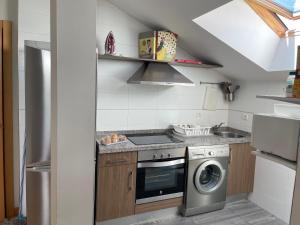 Kuchyňa alebo kuchynka v ubytovaní Sumergete en leon I y II vivienda turística