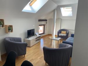 Televízia a/alebo spoločenská miestnosť v ubytovaní Sumergete en leon I y II vivienda turística