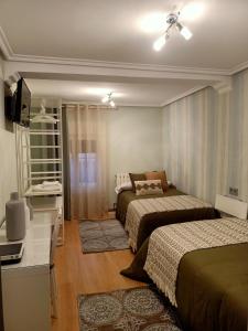 Postel nebo postele na pokoji v ubytování Apartamento Turístico Santiago