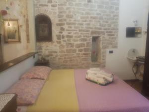 Ένα ή περισσότερα κρεβάτια σε δωμάτιο στο Non ditelo al Duca - Lo Spagna