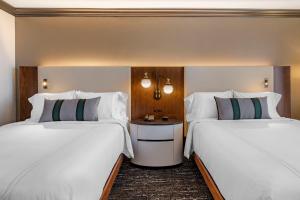 Postel nebo postele na pokoji v ubytování Omni Austin Hotel Downtown