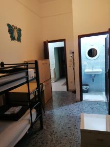 a room with a bed and a sink and a bathroom at Dream Destination Rome in Rome