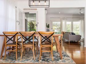 a dining room with a table and chairs at 31 Beech Street in Evans Head
