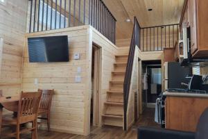 a tiny house with a tv on the wall at 079 Tiny Home nr Grand Canyon South Rim Sleeps 8 in Valle