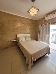 Кровать или кровати в номере Sobrado 2 amplo e confortável em condomínio
