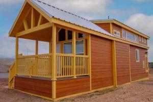 a large wooden cabin with a pitched roof at 073 Tiny Home nr Grand Canyon South Rim Sleeps 8 in Valle