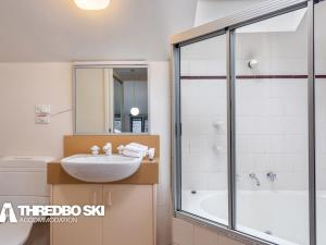 a bathroom with a sink and a shower at Kirkwood 4 in Thredbo