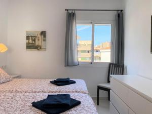 Łóżko lub łóżka w pokoju w obiekcie Apartamento La Torna Casasol