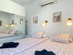 Łóżko lub łóżka w pokoju w obiekcie Apartamento La Torna Casasol