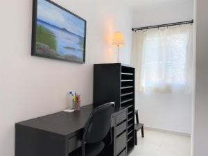 Telewizja i/lub zestaw kina domowego w obiekcie Apartamento La Torna Casasol