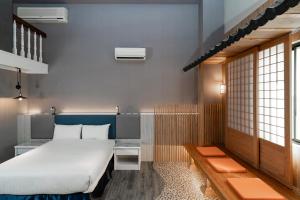 Postel nebo postele na pokoji v ubytování Fu Hsiang Hotel