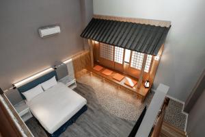 Postel nebo postele na pokoji v ubytování Fu Hsiang Hotel