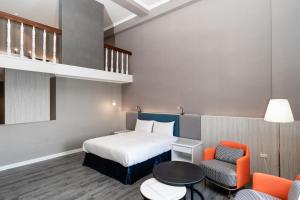 Postel nebo postele na pokoji v ubytování Fu Hsiang Hotel