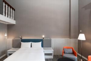 Postel nebo postele na pokoji v ubytování Fu Hsiang Hotel