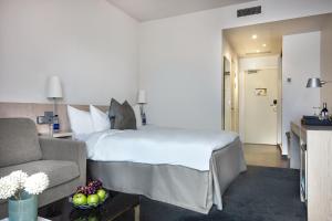 Voodi või voodid majutusasutuse Hotel Riverton toas