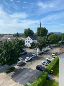 a town with cars parked in a parking lot at NO SMOKE Ferienwohnung Schwalbe in Hagen