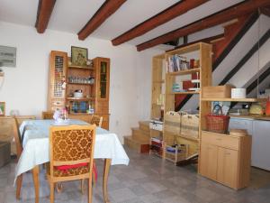 a kitchen with a table and chairs in a room at Ustrine view in Ustrine +16 photos
