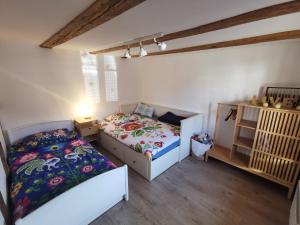 Posteľ alebo postele v izbe v ubytovaní Une Maison à Colombages - Cosy, Lumineuse et Sauna