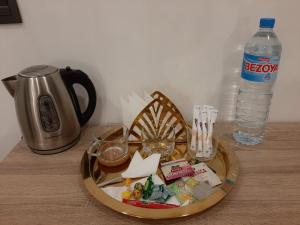 a tray of food and a bottle of water on a table at Habitacion cerca del Aeropuerto in Coslada