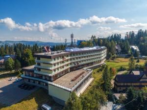 an overhead view of a building with a roof at Rysy in Bukowina Tatrzańska