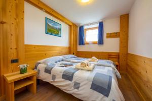 Postel nebo postele na pokoji v ubytování Italia 2 Ski in-Ski out Mt 50 - Happy Rentals