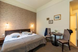 Postel nebo postele na pokoji v ubytování Hotel Sigulda