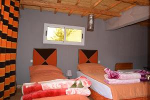 Ein Bett oder Betten in einem Zimmer der Unterkunft Riad Dar Tagine