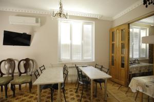 a dining room with a table and chairs at HOTEL COMFORT in Kutaisi