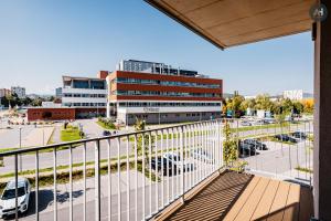 a balcony with a view of a parking lot at AH Nová Terasa II in Košice
