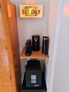 a desk with a coffee maker and a toaster on it at Southsea Royale Studio, James Bond, Parking, Seafront in Portsmouth