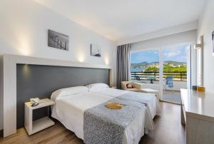 Postel nebo postele na pokoji v ubytování Hotel Vibra Beverly Playa