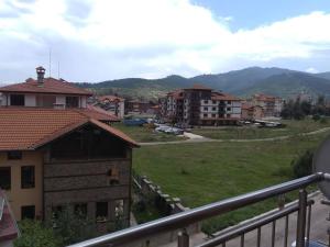 a view from a balcony of a town with buildings at Nev Apart New in Velingrad