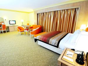 Voodi või voodid majutusasutuse Grand Darul Makmur Hotel Kuantan toas