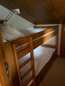 an overhead view of a bunk bed with a ladder at Le CAPRICORNE OLYMPIE 3 in Les Allues