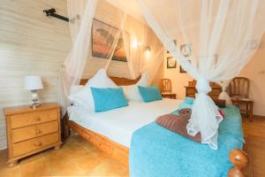 a bedroom with two beds with blue pillows at Villa Dolce Vita in Portocolom +74 photos