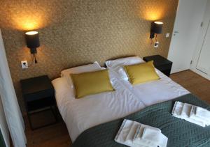 Cama ou camas em um quarto em Het Tolhuis