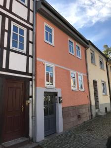 a group of buildings with a door and a street at Ferienwohnung Bad Frankenhausen in Bad Frankenhausen