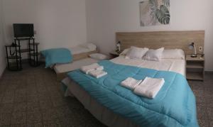Кровать или кровати в номере Multiespacio Center