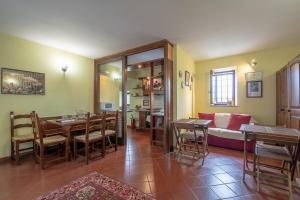 a living room with a table and a couch at La Valle B&B in Asti