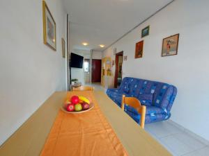 a room with a table with a bowl of fruit on it at Pagoda 4 in Lido di Pomposa