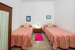 A bed or beds in a room at Casa de María