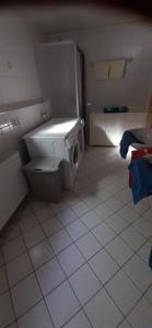 a small bathroom with a toilet and a sink at Rötenbacher Wiesen in Friedenweiler