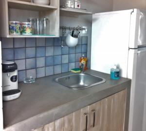 Kuchyň nebo kuchyňský kout v ubytování Allegria Family Hotel