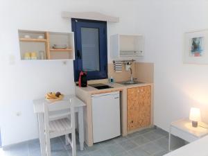 Kuchyň nebo kuchyňský kout v ubytování Allegria Family Hotel