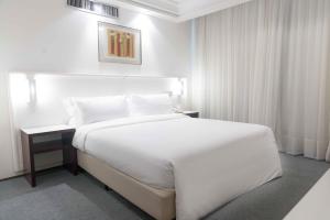 Cama ou camas em um quarto em Plaza São Rafael Hotel