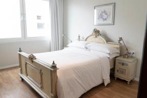 Cama ou camas em um quarto em Plaza São Rafael Hotel